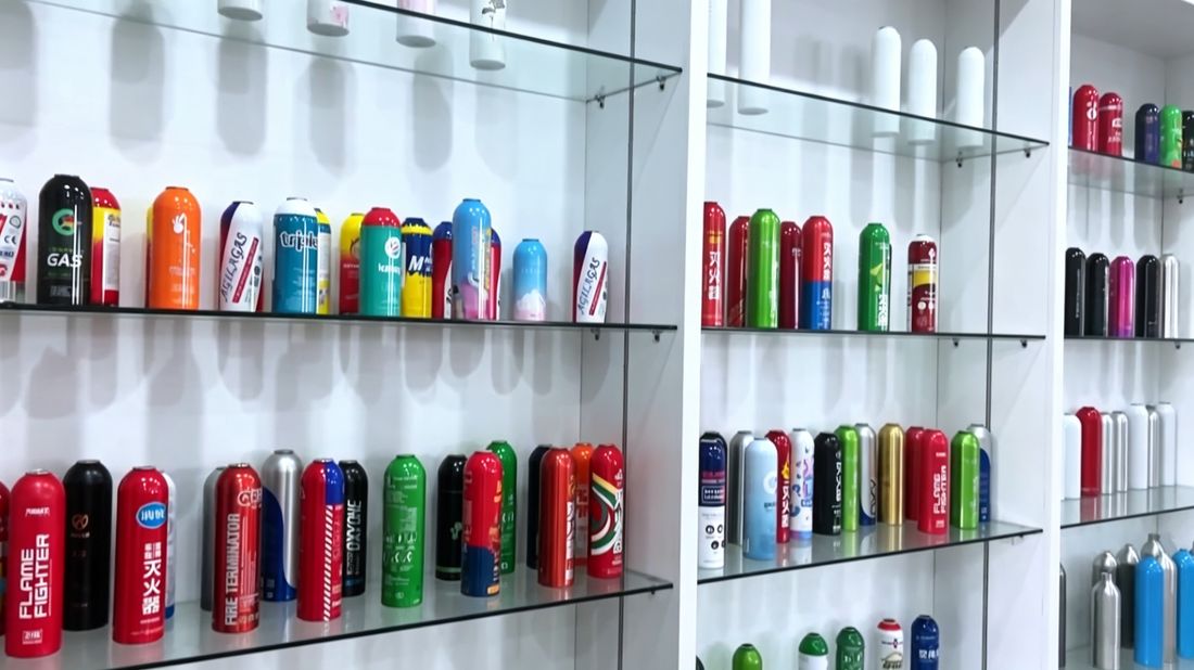 Showroom shelves displaying aluminium aerosol cans, canisters and bottles in many shapes, sizes and finishes